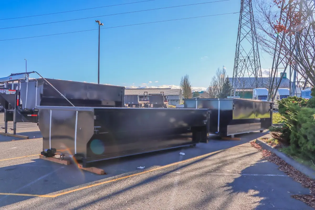Roll-off dumpster ready for waste disposal at job site for Concrete Dumpster Rental in Davenport
